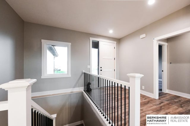 stairs with radiator heating unit and wood-type flooring