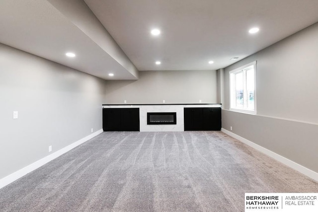 unfurnished living room with carpet flooring