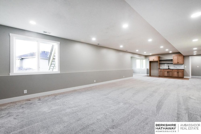 unfurnished living room with carpet