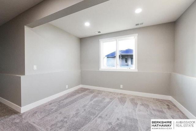 empty room featuring light colored carpet