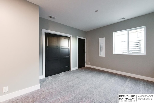 unfurnished bedroom featuring light colored carpet