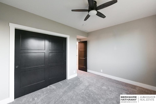 unfurnished bedroom with carpet flooring, a closet, and ceiling fan