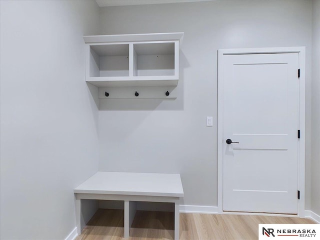 mudroom with light hardwood / wood-style flooring