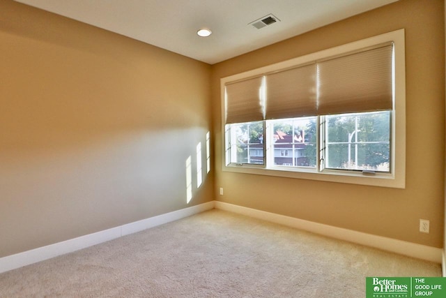 empty room with carpet flooring and plenty of natural light