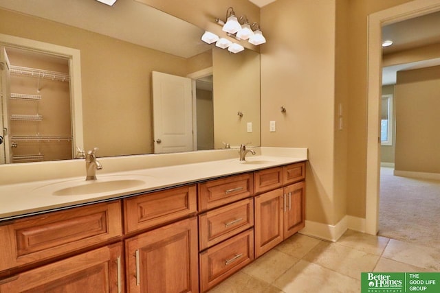 bathroom with tile patterned floors and vanity