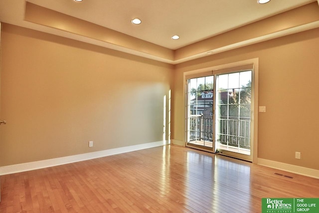 spare room featuring hardwood / wood-style flooring