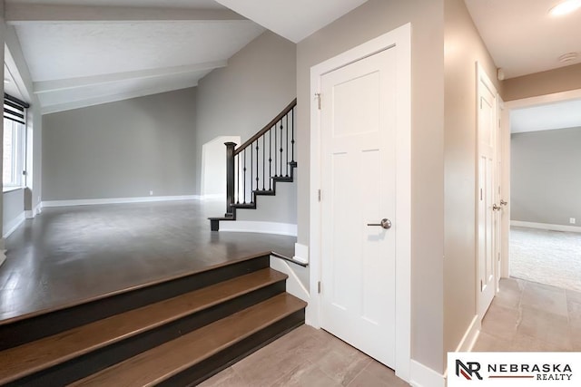 stairs with lofted ceiling