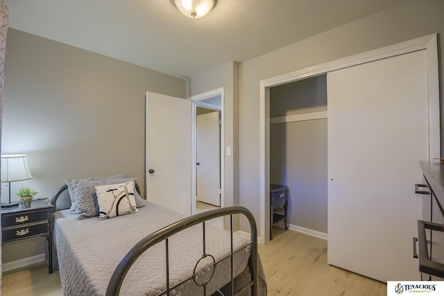 bedroom with a closet and light wood-type flooring