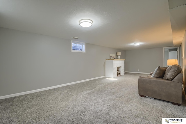 carpeted living room featuring a fireplace