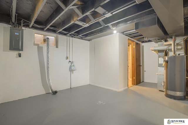 basement featuring electric panel and water heater