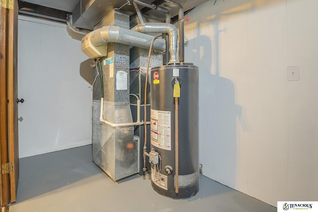 utility room featuring water heater