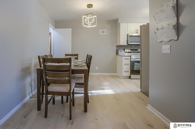 dining space featuring light hardwood / wood-style flooring