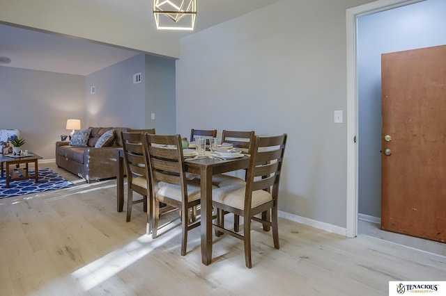 dining area featuring light wood-type flooring