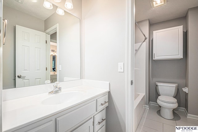 full bathroom featuring vanity, bathtub / shower combination, tile patterned floors, toilet, and a textured ceiling