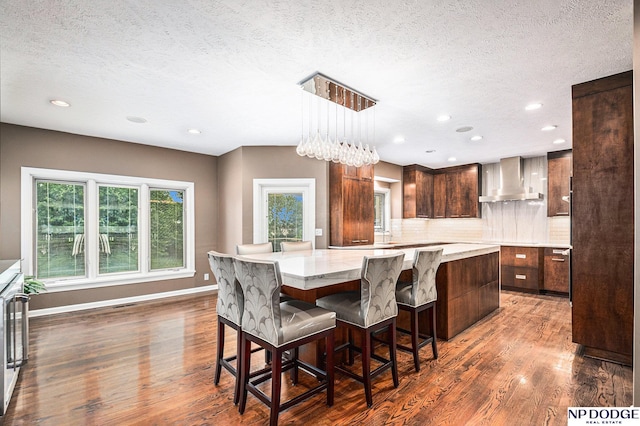 dining area featuring a chandelier, a textured ceiling, and dark hardwood / wood-style floors