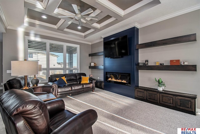 carpeted living room featuring beam ceiling, ceiling fan, coffered ceiling, a fireplace, and ornamental molding