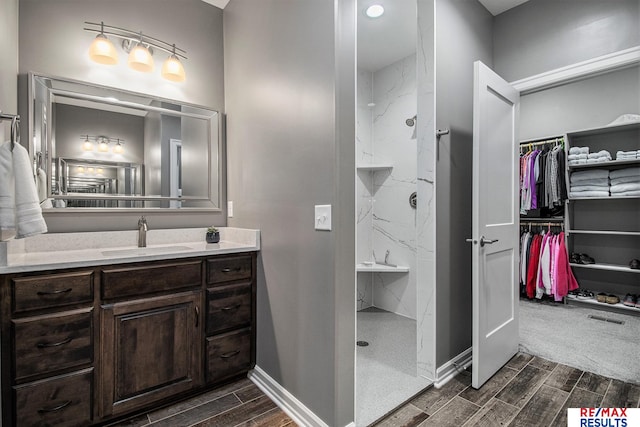 bathroom with vanity and walk in shower