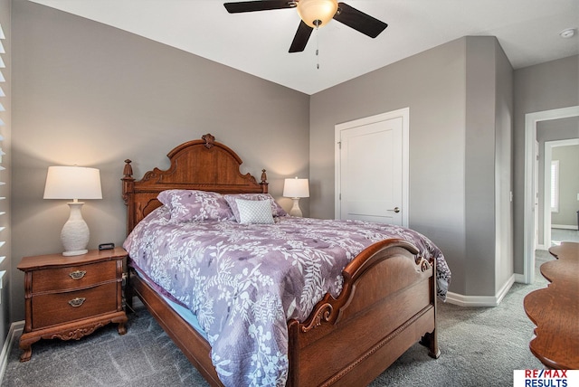 bedroom featuring ceiling fan and dark colored carpet