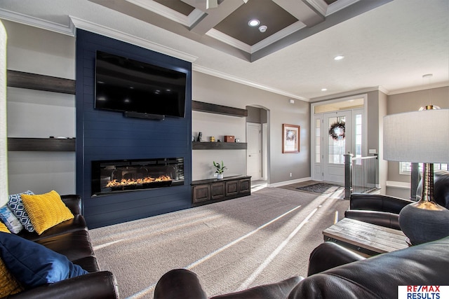 living room featuring carpet flooring, ornamental molding, coffered ceiling, a large fireplace, and beam ceiling