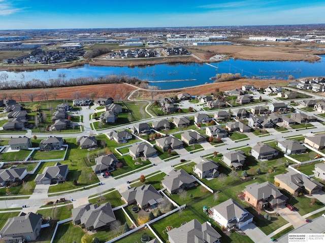 bird's eye view with a residential view and a water view