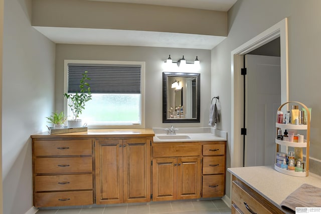 bathroom with tile patterned floors and vanity