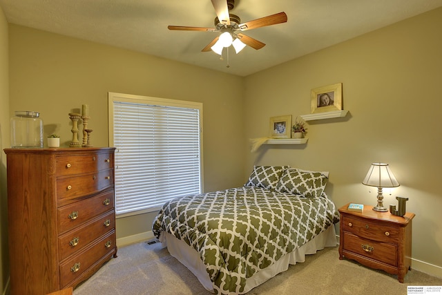 bedroom with baseboards, a ceiling fan, and carpet flooring