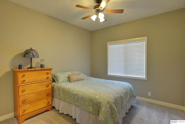 bedroom with baseboards, light carpet, and ceiling fan