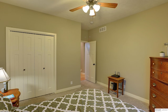 unfurnished bedroom with visible vents, light carpet, a closet, baseboards, and ceiling fan