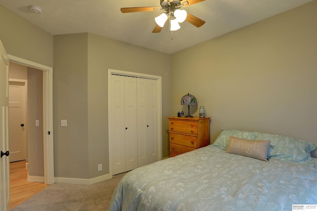 bedroom with carpet, ceiling fan, and a closet