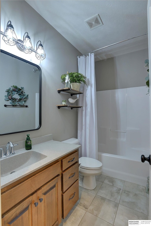 bathroom with visible vents, toilet, tile patterned floors, shower / bath combination with curtain, and vanity