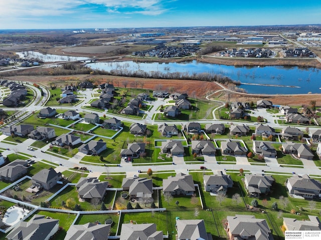 bird's eye view with a residential view and a water view