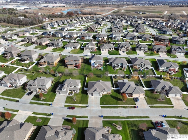 birds eye view of property with a residential view