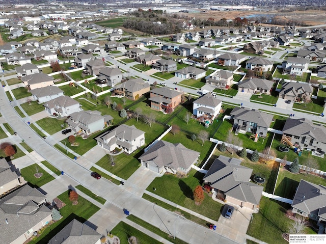 birds eye view of property with a residential view