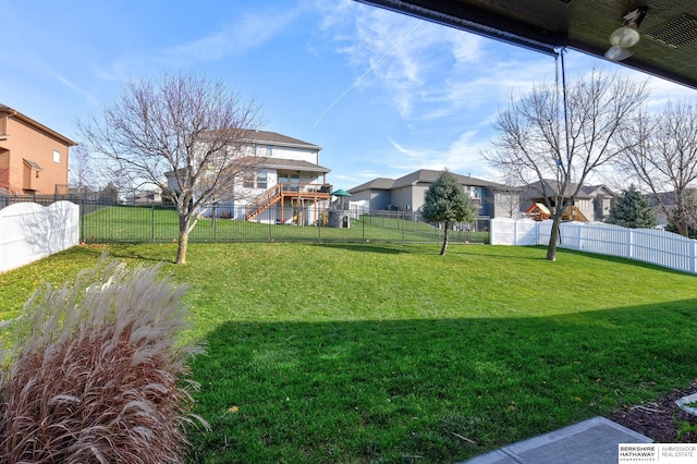 view of yard with a residential view and a fenced backyard