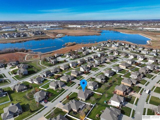 aerial view featuring a water view and a residential view