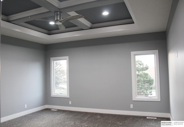 carpeted spare room featuring coffered ceiling, crown molding, beam ceiling, and ceiling fan