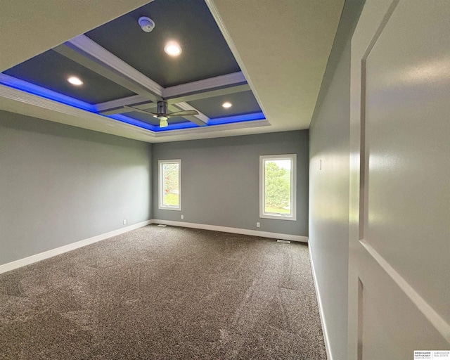 carpeted spare room with coffered ceiling