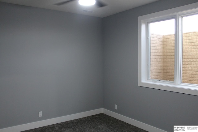 spare room with ceiling fan