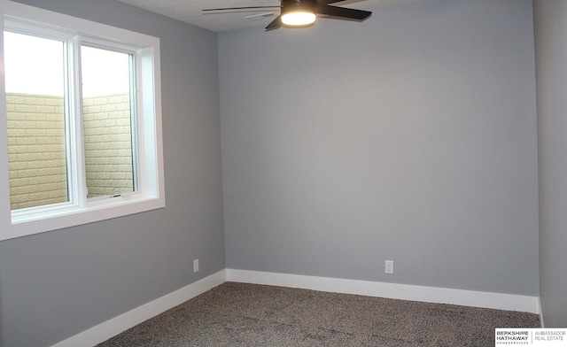 carpeted spare room with ceiling fan and a wealth of natural light