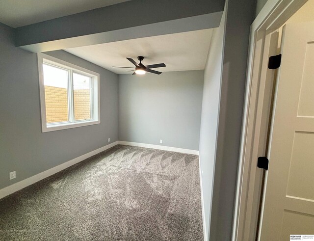 spare room featuring carpet floors and ceiling fan