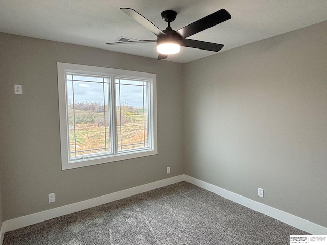 spare room with ceiling fan and carpet floors