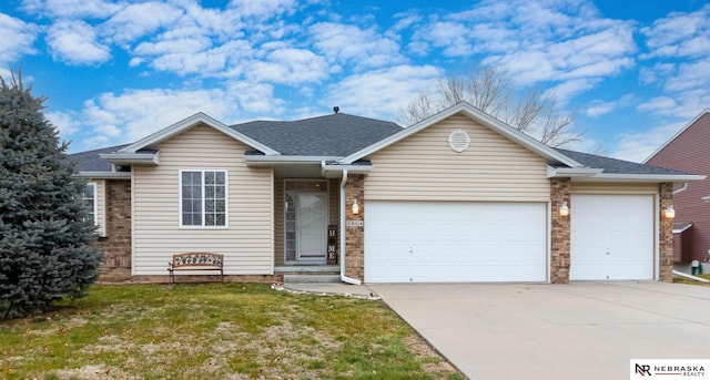 ranch-style home with a front yard and a garage