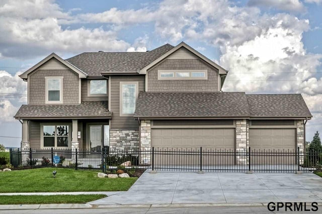 view of front facade with a front lawn and a garage