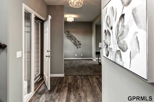 hall with dark hardwood / wood-style flooring