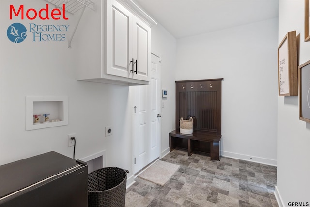 clothes washing area with hookup for a washing machine, cabinets, and hookup for an electric dryer