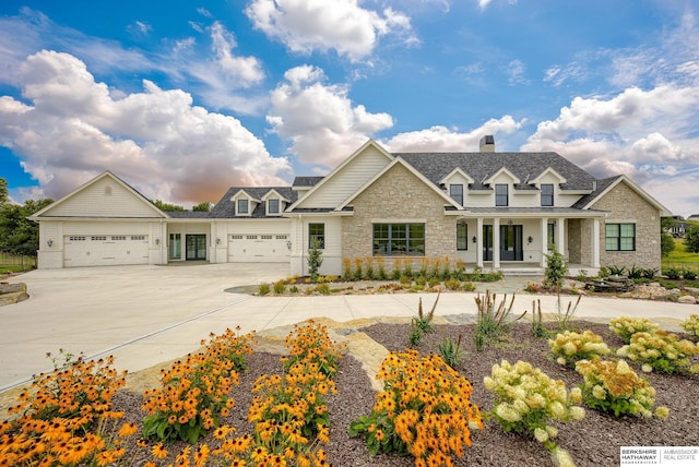 view of front of home with a porch and a garage