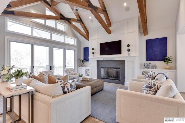 living room with beam ceiling, french doors, high vaulted ceiling, a fireplace, and light wood-type flooring