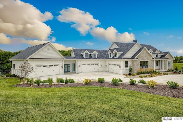 view of front facade with a front lawn and a garage