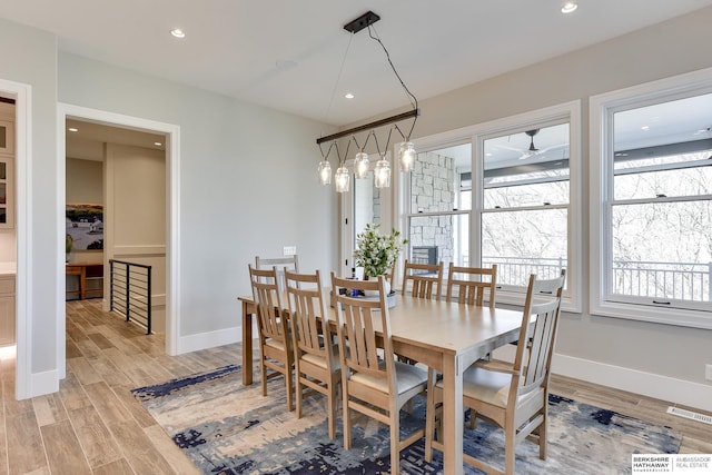 dining space featuring light wood-type flooring