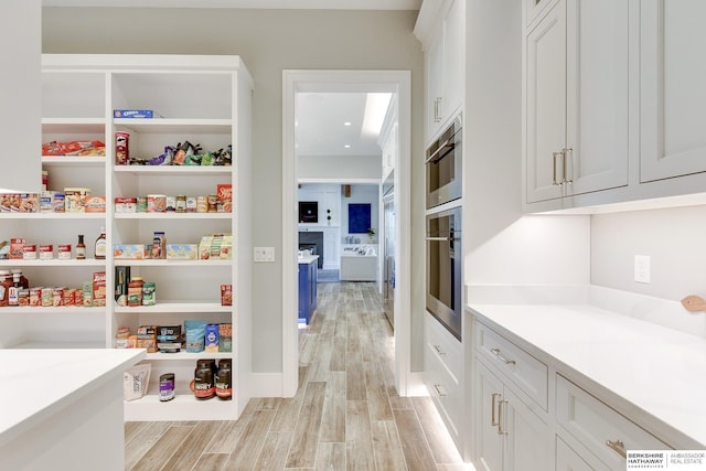 pantry featuring washer / clothes dryer